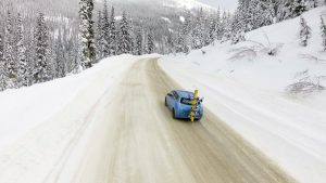 Electric Car snow packed road ski adventure